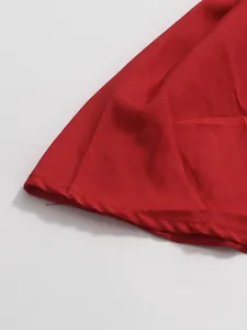 Close-up detail of the hem and stitching on a vibrant red French style skirt