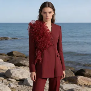 Elegant burgundy blazer suit for women featuring dramatic ruffle patchwork on shoulder.