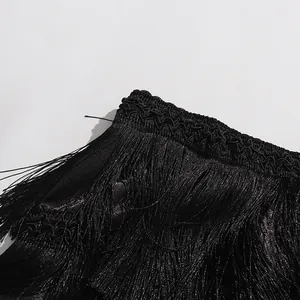 Close-up detail of black fringe on a vintage style high-waist tiered skirt for women