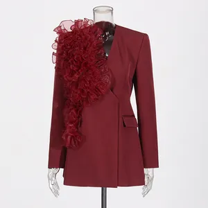 Detailed view of the elegant burgundy blazer with large organza ruffle patchwork