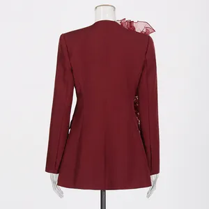 Rear view of elegant burgundy blazer with ruffled mesh shoulder detail for women