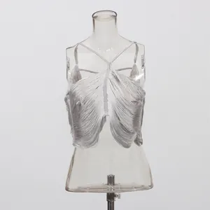 Detailed view of women's silver halter vest featuring irregular fringe and fishbone straps
