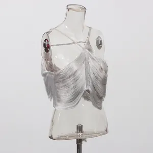 Detailed side view of a shimmering silver fringe halter top displayed on a mannequin