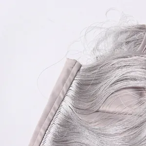 Macro view showing fine silver fringe detail and high-quality stitching on a corset top