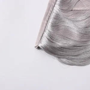 Close-up detail of shimmering silver fringe on a stylish off-shoulder halter neck crop top.