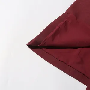 Close-up of the wine-red fabric and smooth inner lining of the elegant women's blazer