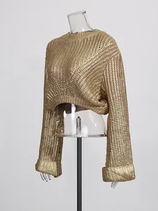 Elegant gold metallic knit cropped sweater with long sleeves shown on a clear mannequin