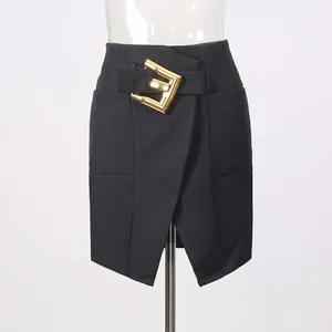 Detailed view of elegant black wrap mini skirt with a stylish gold metal buckle.