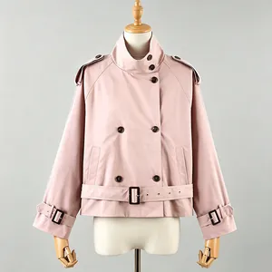 Pink short trench coat on mannequin featuring double-breasted buttons and belt detail.