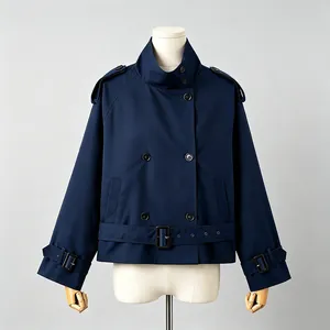 Detailed macro view of a navy blue British style vintage short trench coat for women