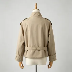 Detailed rear view of a khaki British style short trench coat with shoulder tabs and belt.