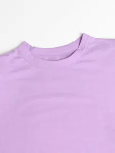 Close-up detail of the durable double-stitched round neckline on a light purple summer dress
