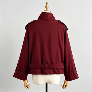 Back view of a burgundy retro British style short trench coat jacket for women