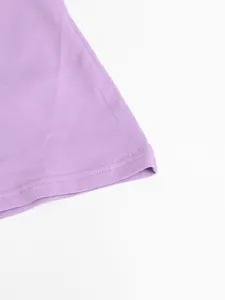 Macro detail of high-quality double-stitched hem on a purple cotton casual summer dress