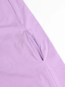 Detail view of the practical side seam pocket on a soft purple summer casual dress.
