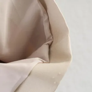 Detailed close-up view showing the high-quality beige trench coat fabric texture and lining