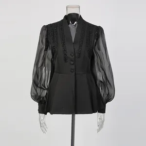 Front view of elegant vintage black blouse with beaded stripes and lantern sleeves