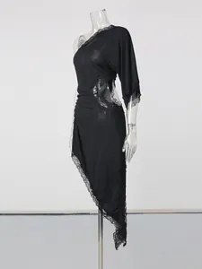 Elegant black one-shoulder dress with waist cutout and irregular lace hem detail.