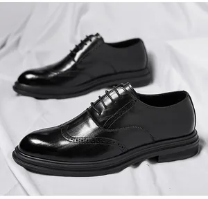 Detail view of black Brogue leather shoes with intricate perforated patterns and thick sole