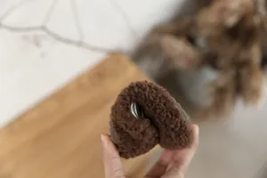 Flexible brown fleece-lined winter shoe for girls showing exceptional sole softness