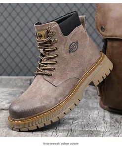 Detailed close-up of brown suede work boot featuring a wear-resistant rubber outsole