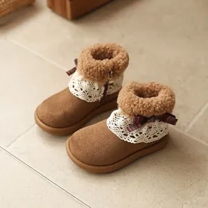 Cozy brown girl's snow boots with white lace trim and burgundy bow detail