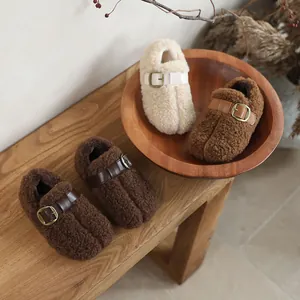 Cozy fuzzy children's split-toe slippers with warm fleece lining and stylish buckle strap