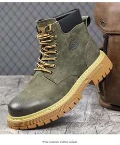Close-up view of green suede work boot with wear-resistant rubber outsole.