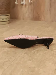 Side view of pink tweed pointed-toe stiletto heel mule shoe showing sole detail
