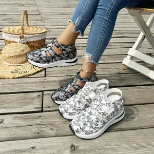 Floral print platform sandals with adjustable straps for women on wood deck