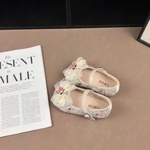 Elegant girls' Mary Jane shoes featuring sparkly sequins and a delicate tulle bow detail