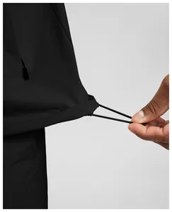 Close-up of adjustable elastic drawstring hem on water-repellent sports jacket