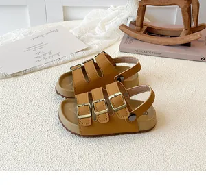 Stylish brown children's sandals with triple buckle straps and cork soles, side view