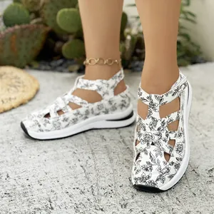 Detailed view of floral print wedge sandals with velcro straps for women