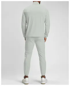 Back view of sustainable men's breathable quick-dry sports jacket and jogger pants set