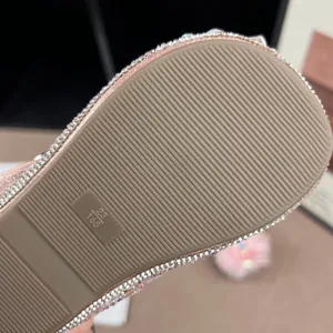Close-up view of the anti-slip textured rubber sole on pink girls glitter princess shoes