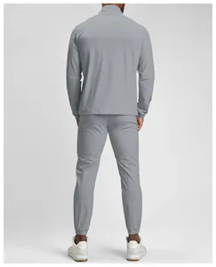Back view of men's quick-dry eco-friendly athletic tracksuit in grey with stand collar