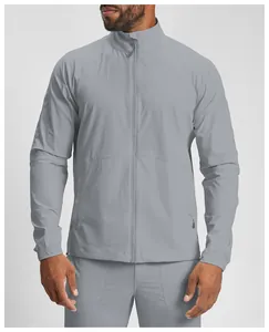 Detailed view of the grey zip-up jacket's breathable fabric and stand-up collar