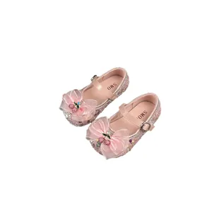 Elegant sparkling pink girls' princess dress shoes with large bow and cherry detail