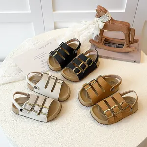 Children's cork sandals with adjustable triple buckles in black, white, and tan colors.