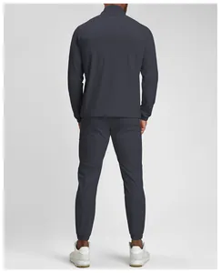Back view of men's charcoal gray quick-dry breathable athletic tracksuit set for fitness