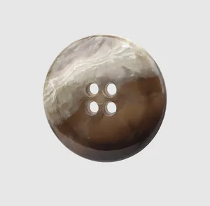Detailed view of a premium four-hole urea button featuring a brown and beige marbled texture