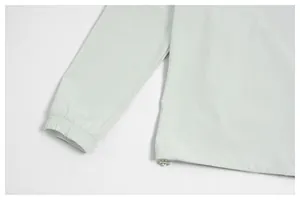 Detailed view of elastic cuffs and adjustable hem on quick-dry men's athletic jacket