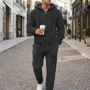 Men's thick fleece hooded tracksuit 2-piece set in charcoal grey on city street.