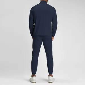 Back view of a navy blue eco-friendly quick-dry men's athletic tracksuit set for gym