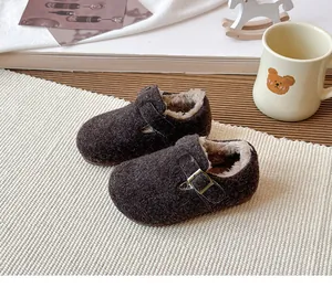 Close-up of cozy brown children's wool clogs featuring warm plush fleece lining