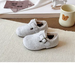 Soft grey fleece-lined children's winter clogs featuring an adjustable buckle strap
