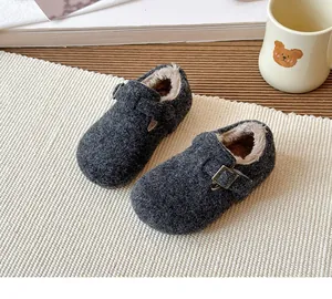 Detailed view of cozy children's felt clogs featuring warm plush lining and buckle strap