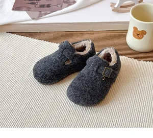 Close-up of cozy wool felt kids' clogs with warm faux fur lining and buckle strap