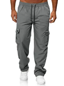 Detailed view of men's grey cargo pants featuring elastic waist and flap pockets